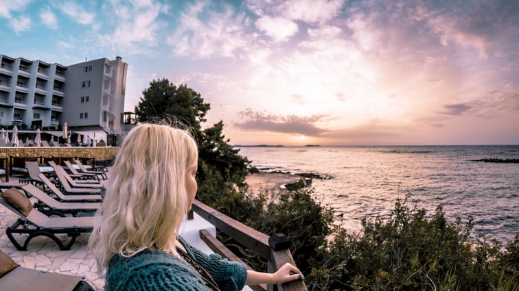 blonde-little-girl-looking-sea-evening-sky-background