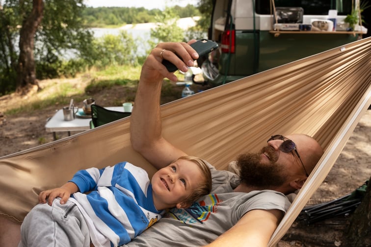 man-kid-taking-selfie-hammock-side-view