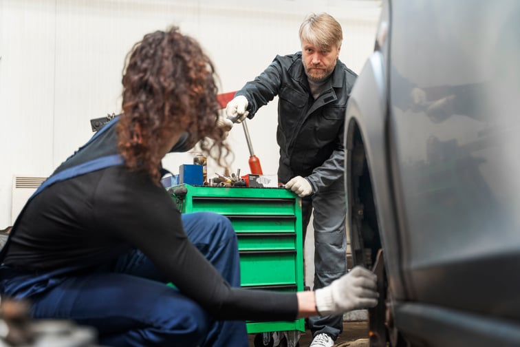 side-view-woman-repairing-car